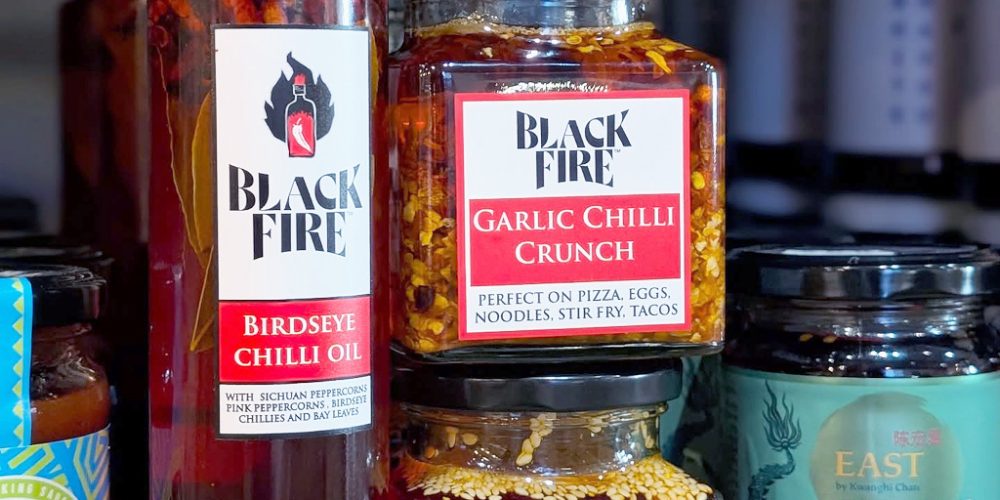Black Fire chilli oil and garlic chilli crunch on display at Indie Füde artisan food shop in Belfast.