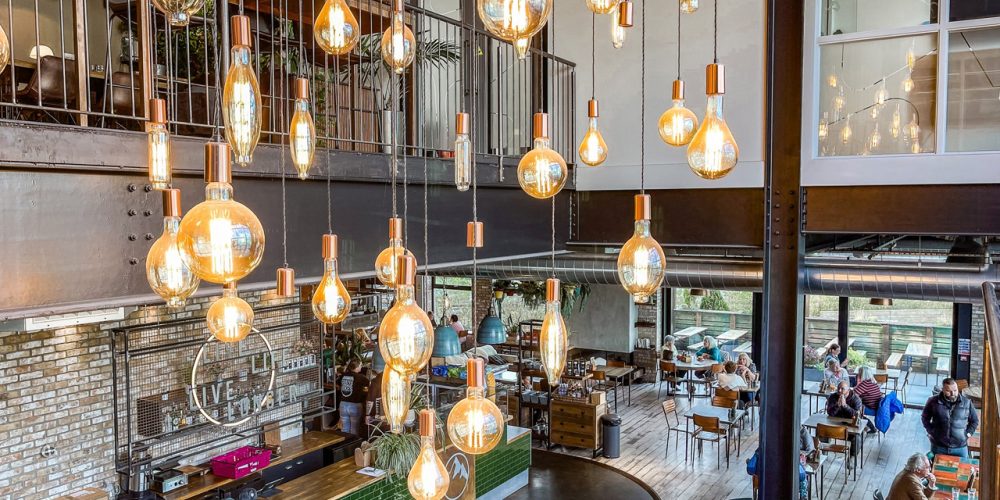 Interior of Café 360 at Cycle 360 on the Isle of Man with seating and bar area