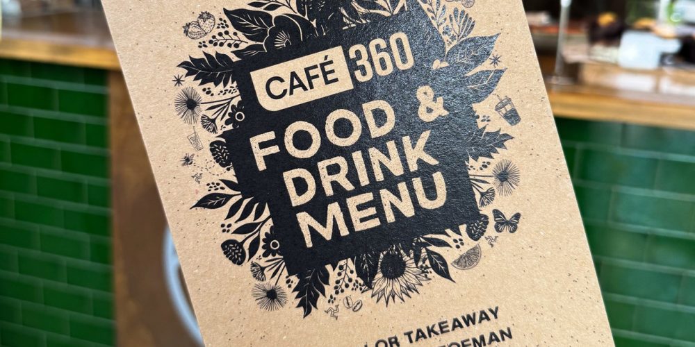 Café 360 food and drink menu displayed inside the café on the Isle of Man