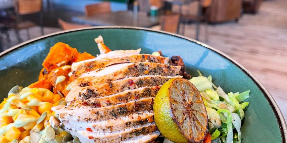 Grilled chicken salad bowl with fresh vegetables served at Café 360 on the Isle of Man