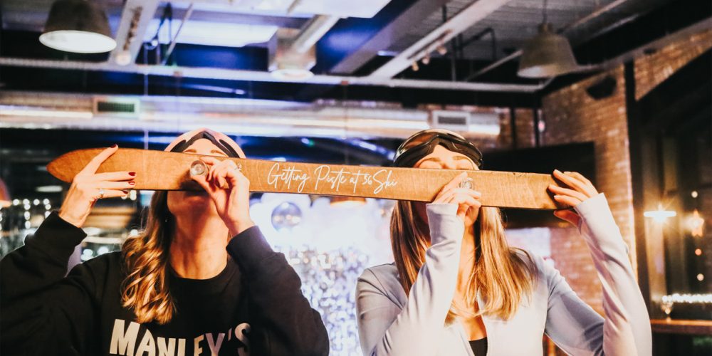 Guests enjoying a ski-themed event inside Café 360 on the Isle of Man
