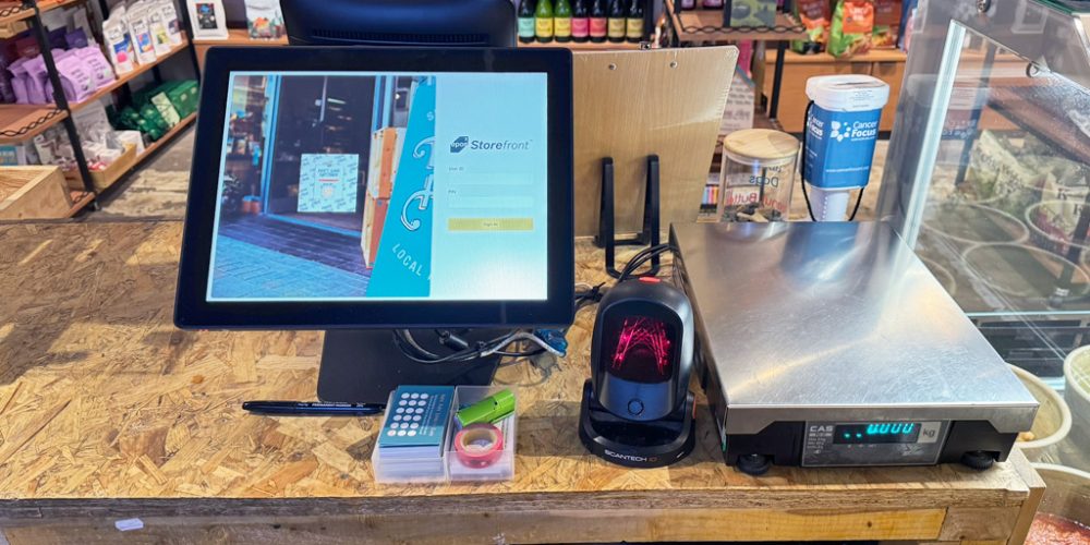EPOS Cubed Storefront POS system with barcode scanner and scale at Indie Füde food shop in Belfast.