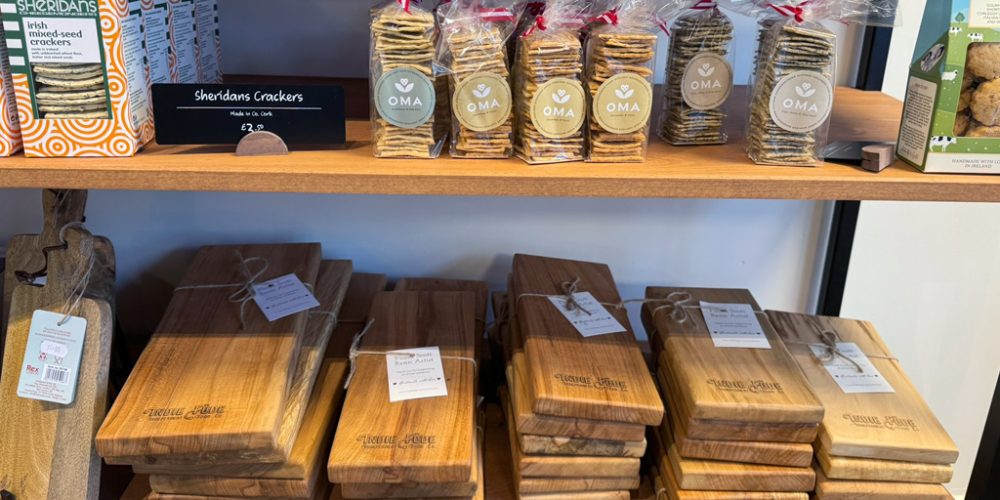 Artisan crackers and handmade cheeseboards displayed at Indie Füde deli in Belfast.