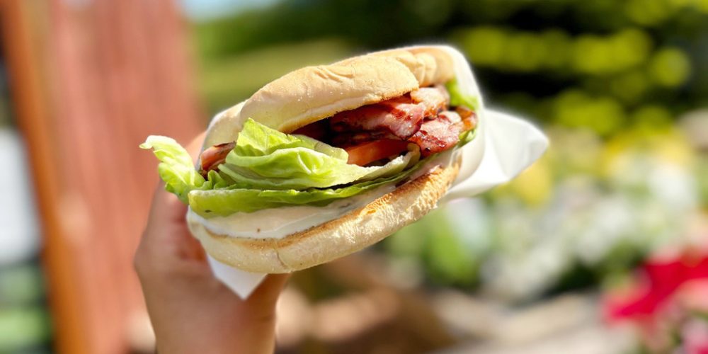 Fresh bacon roll served outdoors at Kilnford Farm Shop café