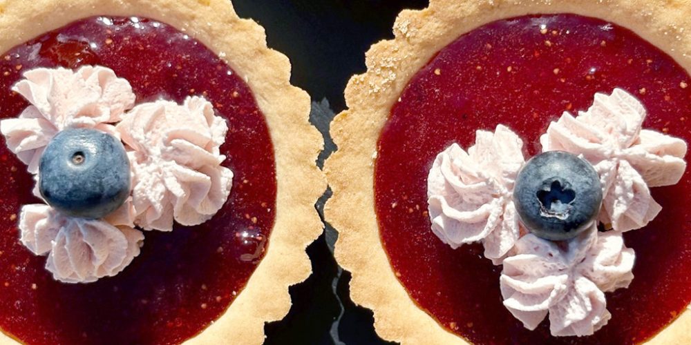 Fresh fruit tarts displayed at Kilnford Farm Shop bakery counter