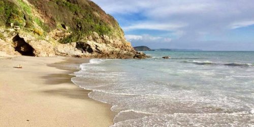 Quiet sandy beach and coastline near Mevagissey in Cornwall
