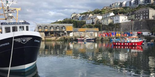 Fishing boats moored in Mevagissey harbour on the Cornish coast