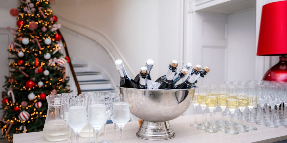 Champagne and welcome drinks set up at a Christmas event reception inside Woodbourne House on the Isle of Man.
