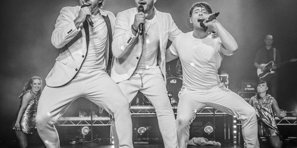 Live band performing on stage at an event at Woodbourne House.