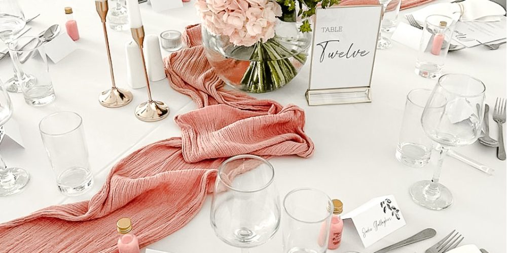 Wedding table setting with blush floral centrepiece at Woodbourne House.