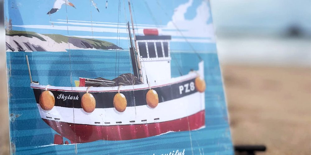 coastal art print featuring fishing boat and seaside scene