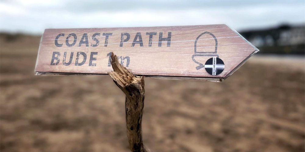 wooden coastal sign giftware with beach backdrop