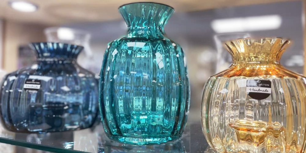 coloured glass vases in blue green and amber tones