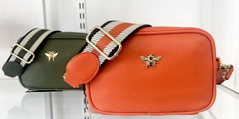 Designer crossbody bags by Alice Wheeler on display at Wroes department store.