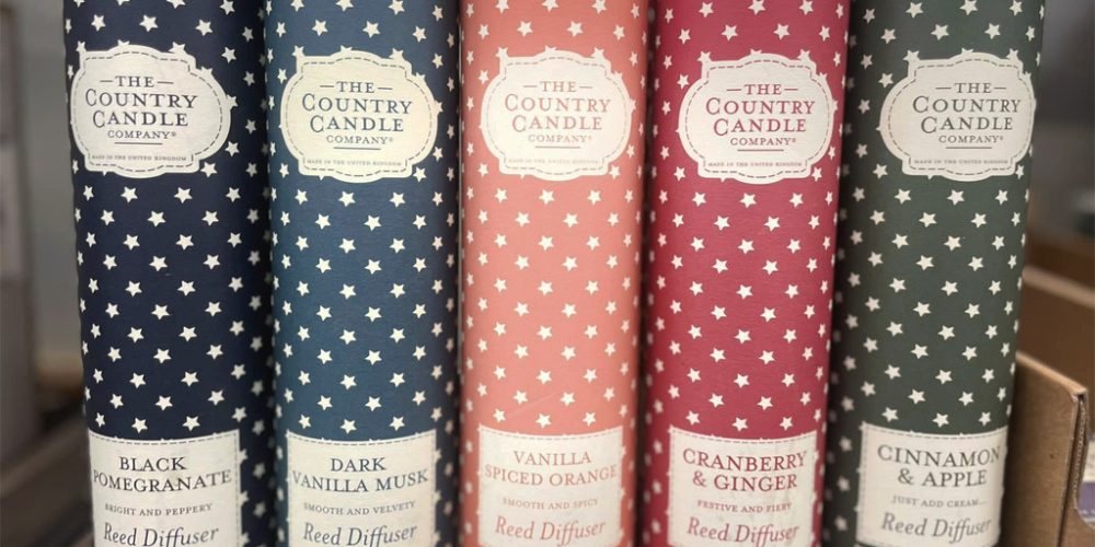 reed diffusers in decorative packaging with various scents