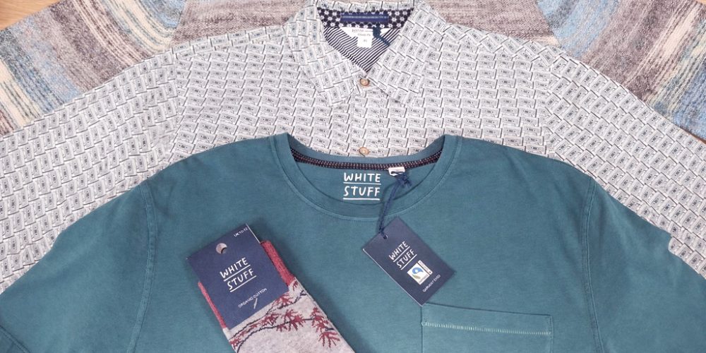 white stuff menswear t shirt and patterned shirts laid out together